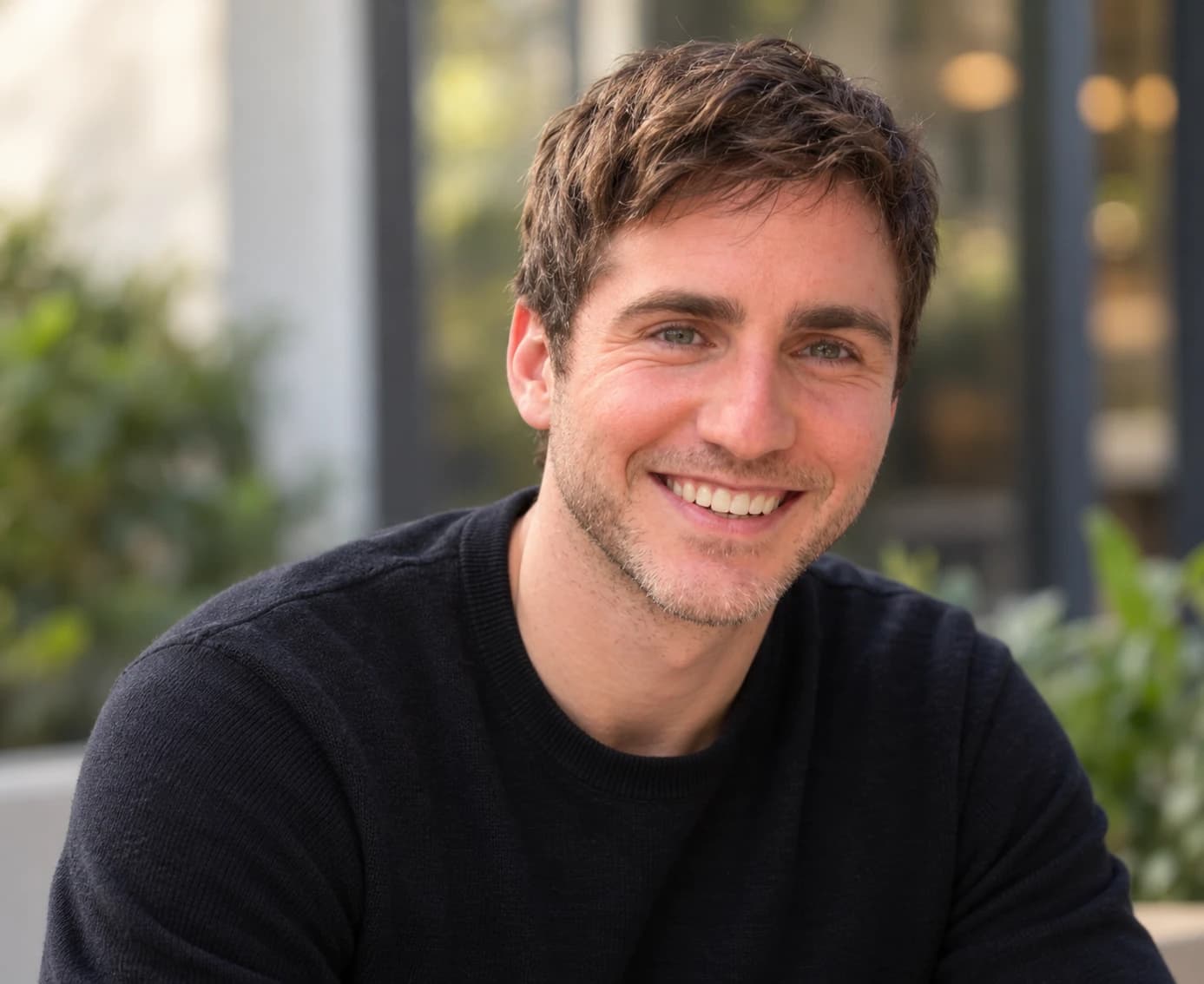 Andrew Rockwell, smiling, in a black sweater